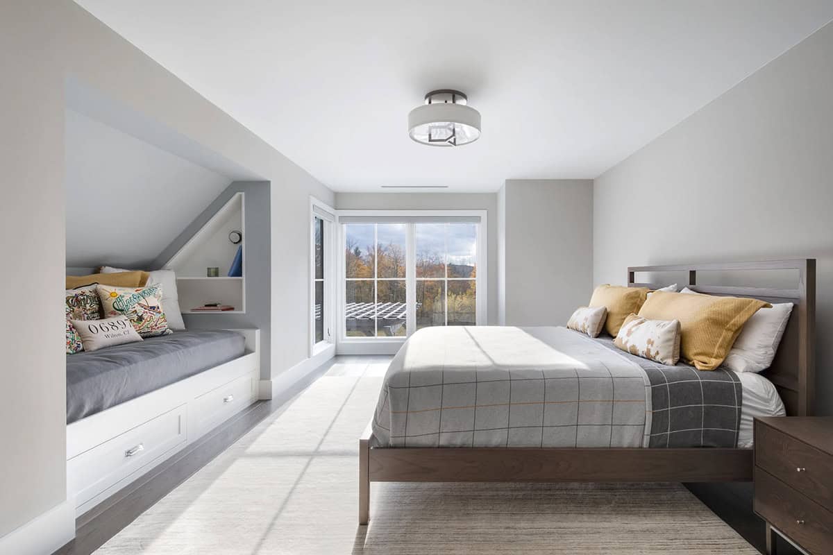 Bedroom with built-in daybed nook and walkout deck