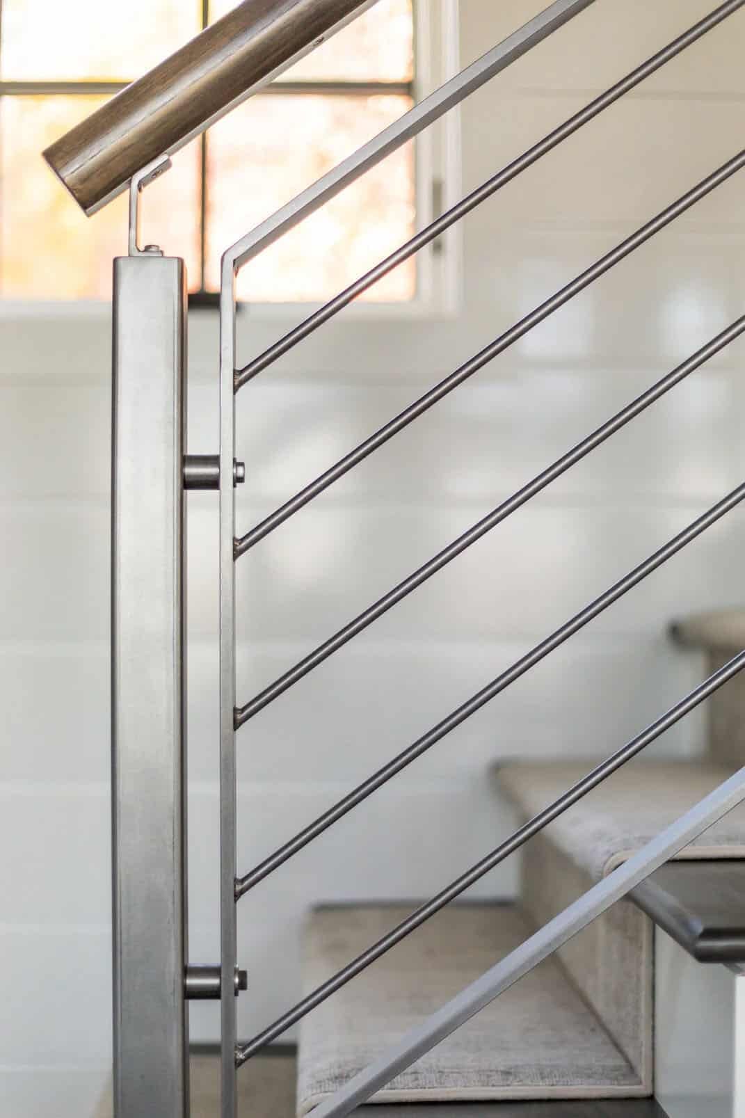 Detail of cable stair railing with wood handrail
