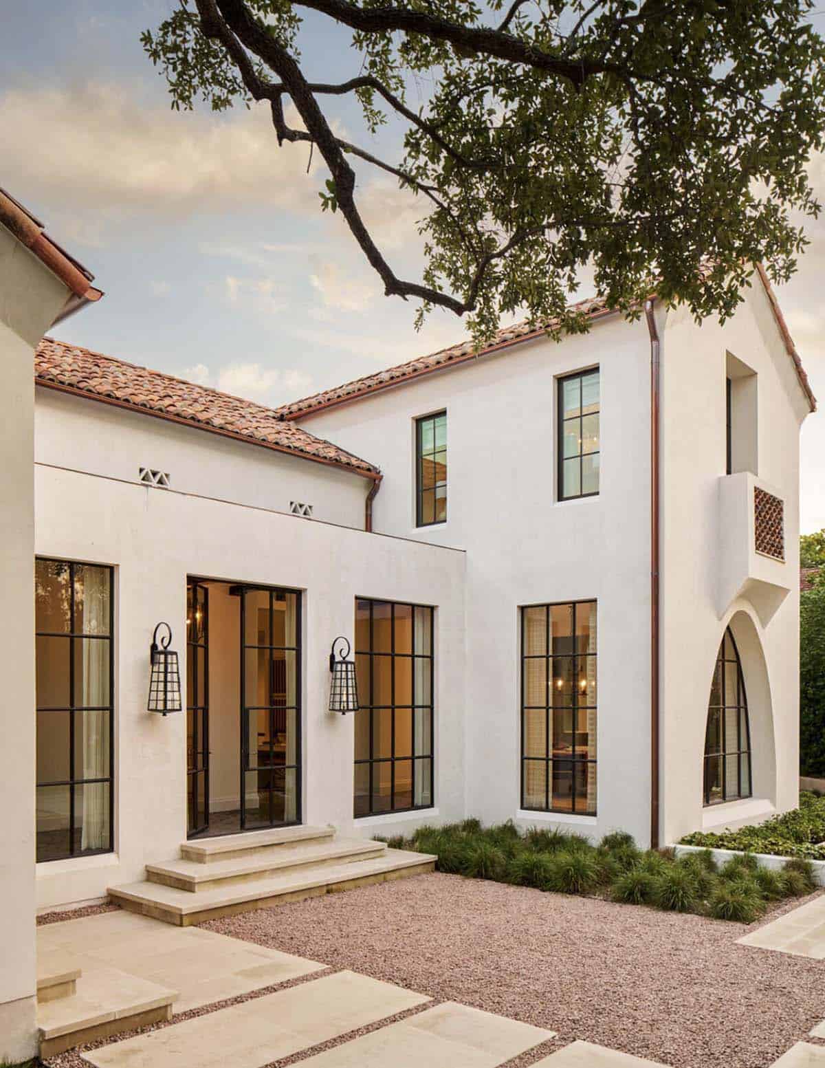 Spanish Colonial Revival home in Texas with steel windows and arched window detail