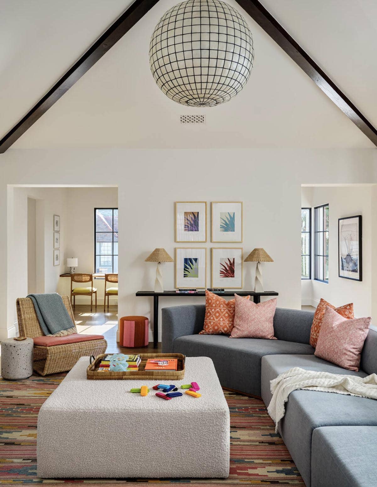 Family room with capiz shell pendant and gray sectional sofa