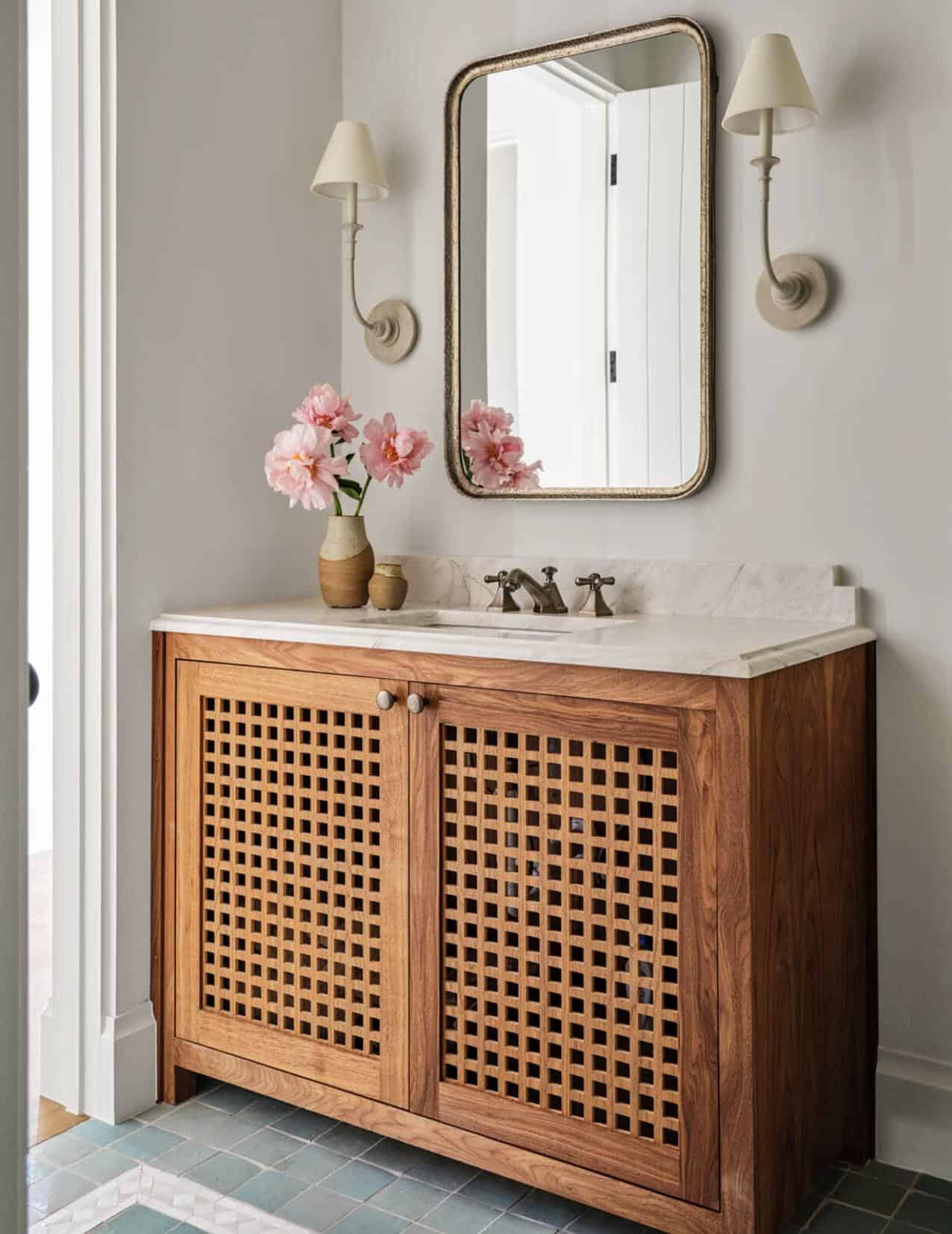 Bathroom vanity with lattice wood cabinet and arched mirror