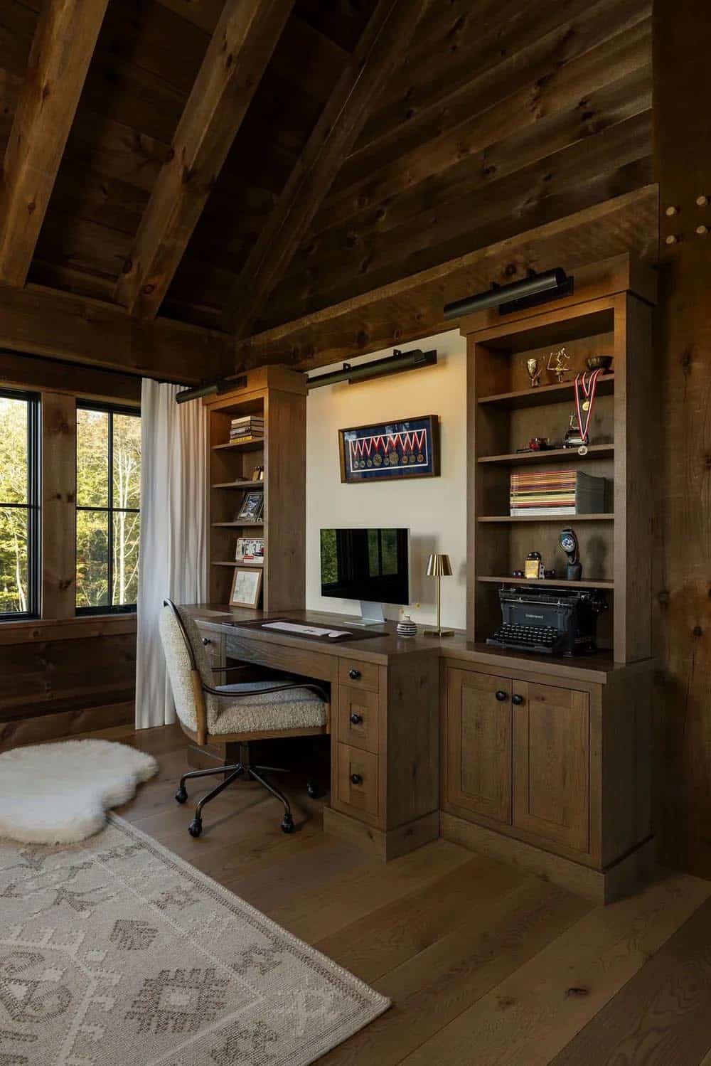 Home office with built-in desk, bookshelves, and trophy display