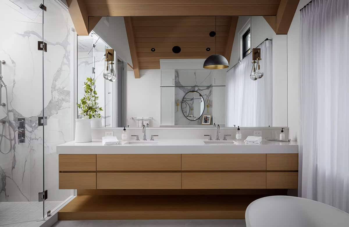 Primary ensuite with floating oak double vanity, full-length mirror, cedar ceiling with timber beams, and marble shower