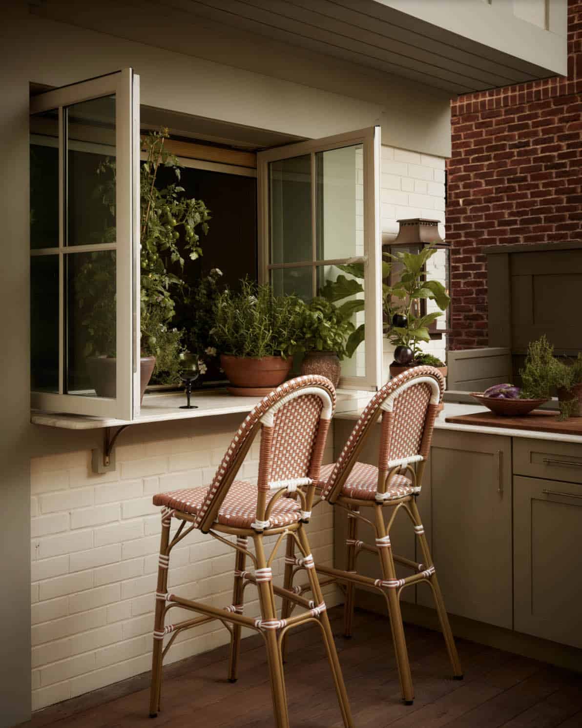 Pass-through window bar with rattan stools and brick chimney