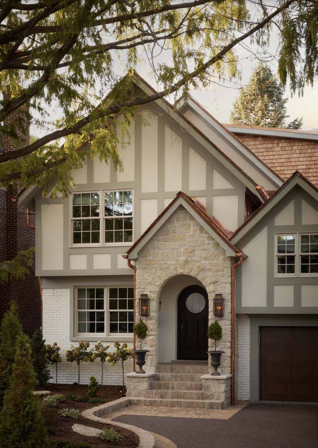 Tudor-style exterior with half-timbering and stone entry archway