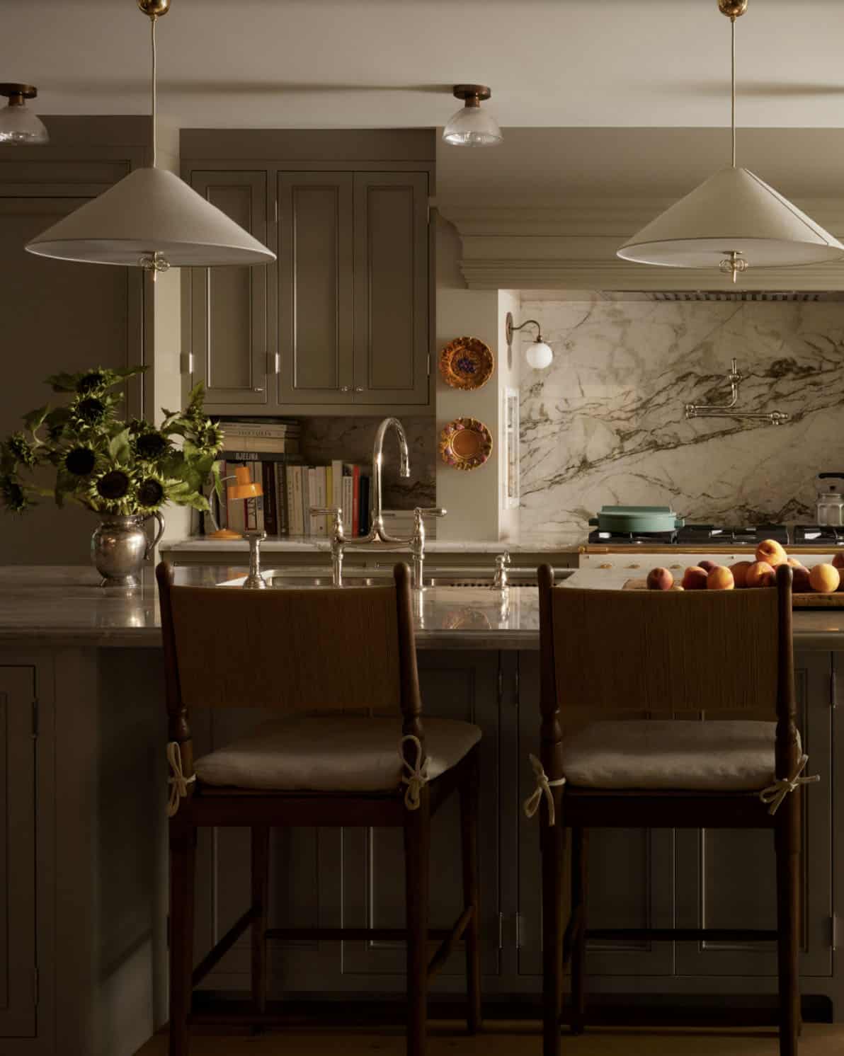 Kitchen island view with sunflowers and cone pendant lights