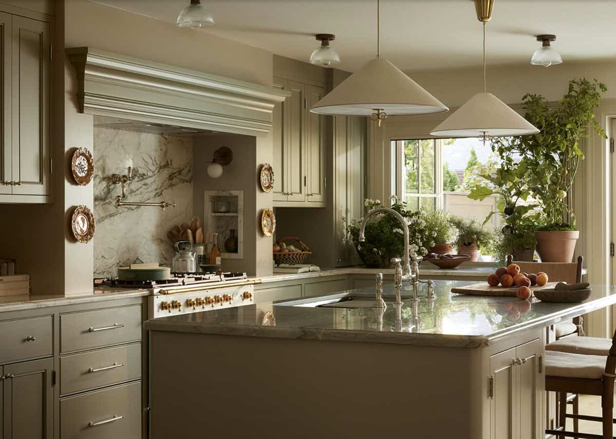 L-shaped kitchen island with marble counters and potted plants