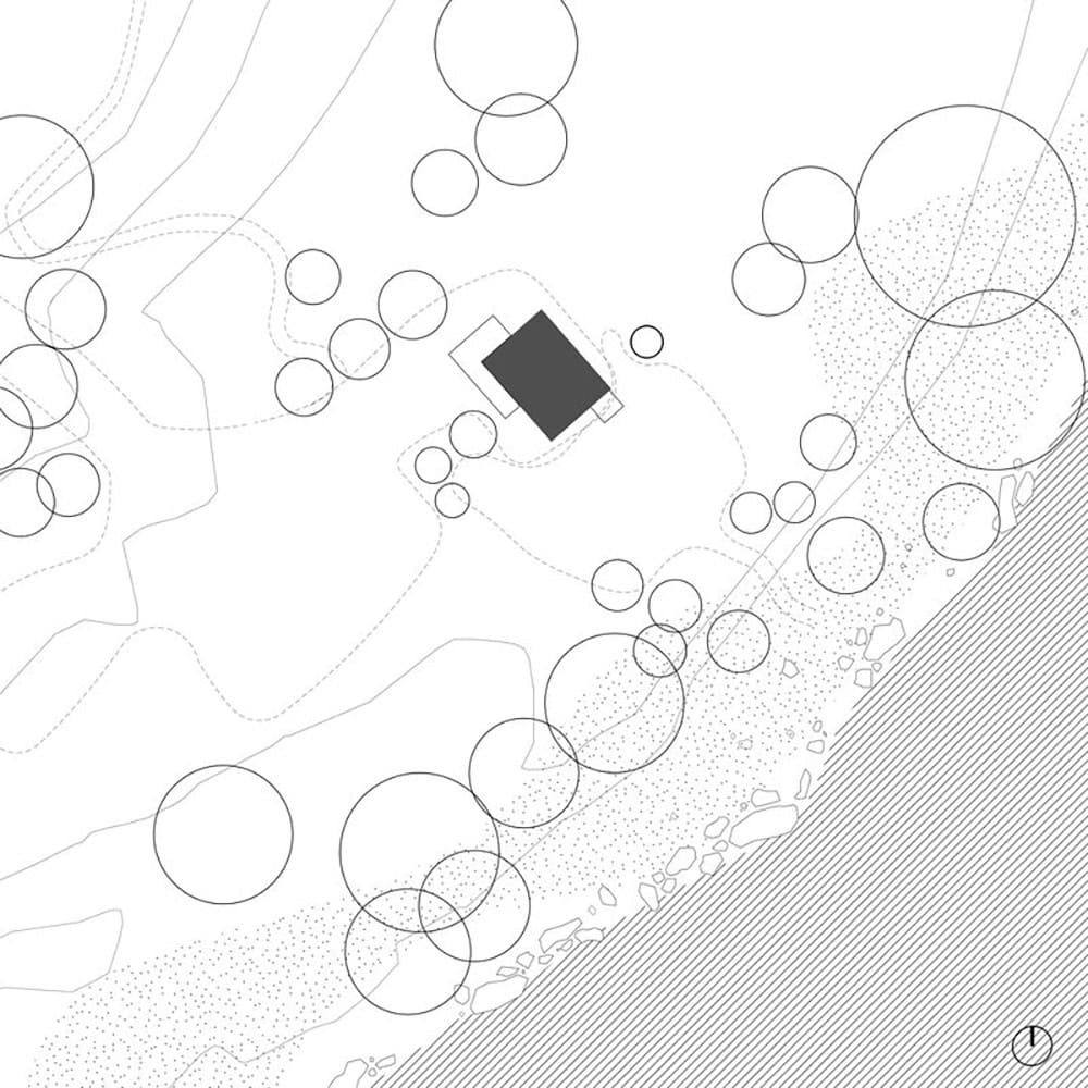 Site plan showing cabin footprint among existing trees with Wenatchee River and rocky bank