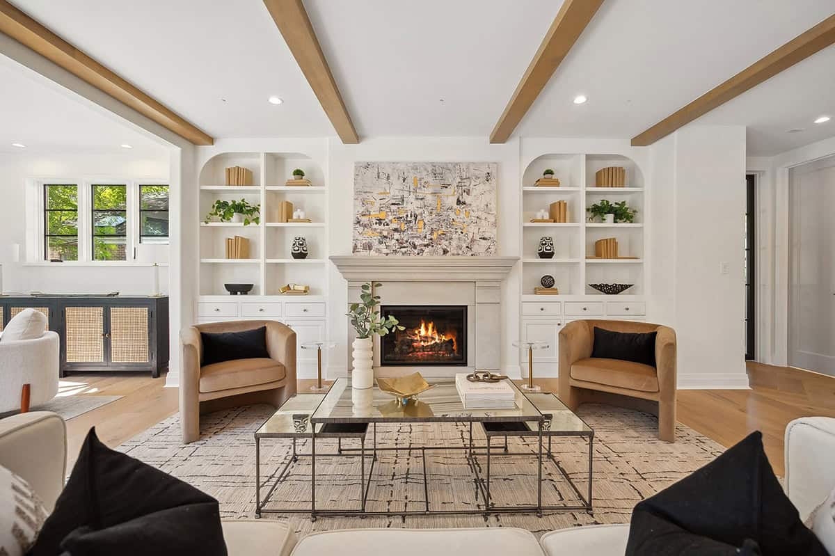 Living room with stone fireplace and built in shelving