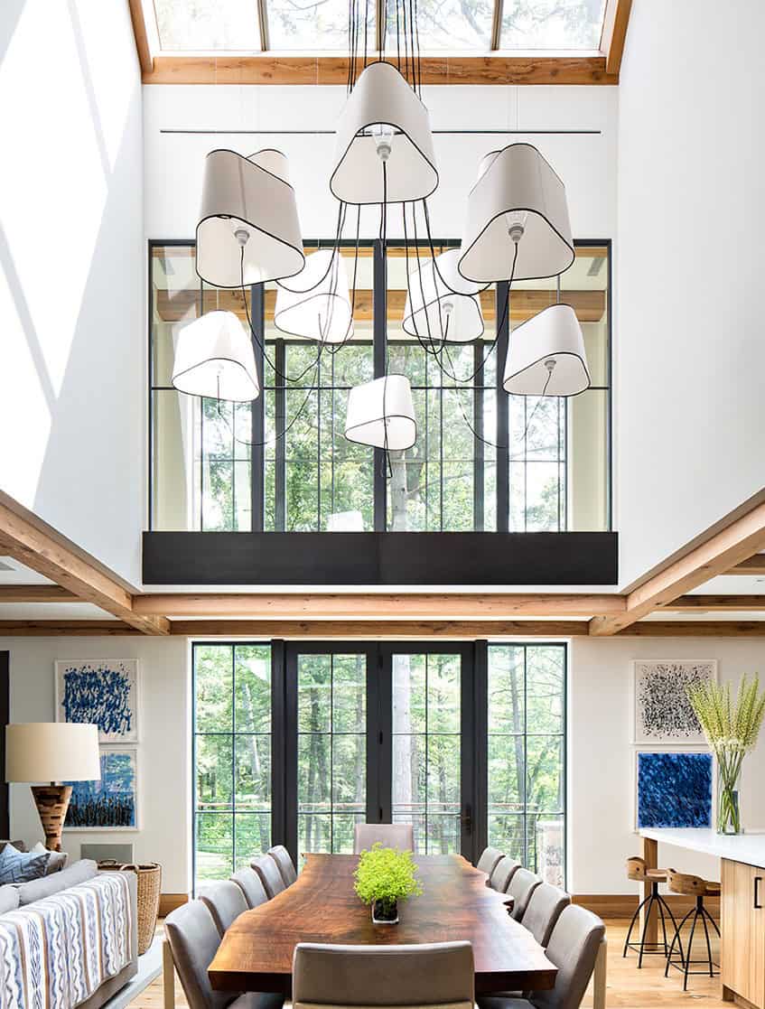 Dining room with cluster pendant lights and tall windows