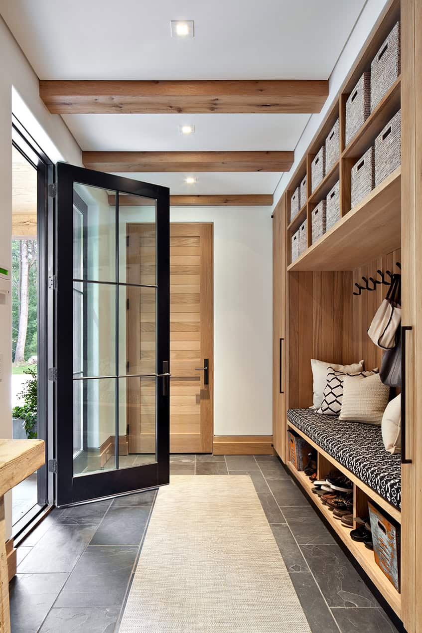 Mudroom with built-in bench and woven storage bins
