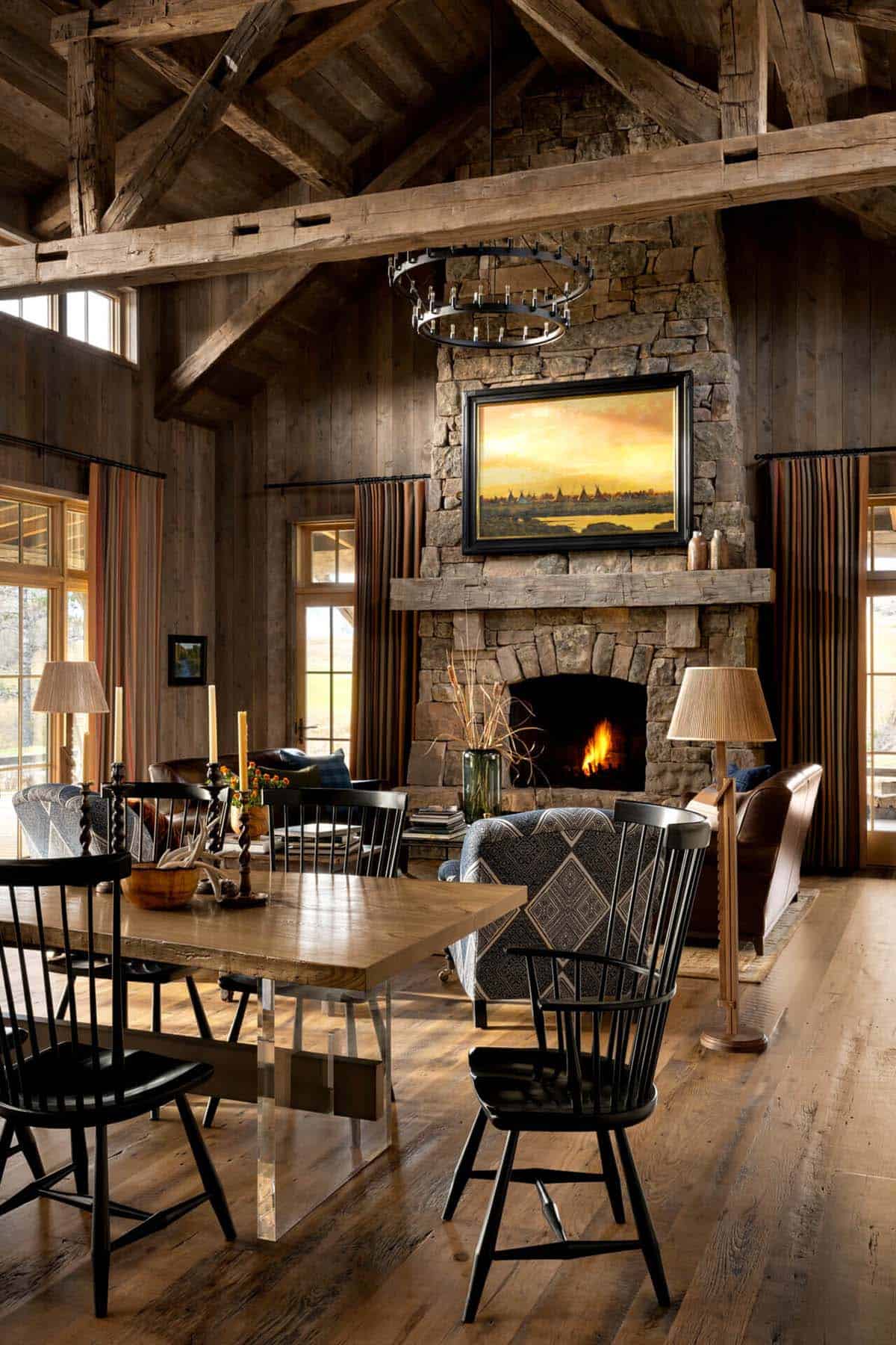 Great room with vaulted wood-beamed ceiling and stone fireplace