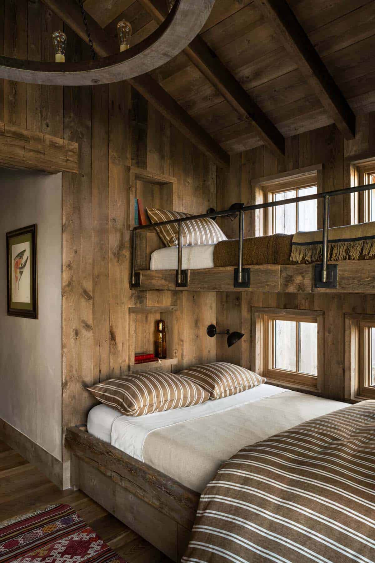Bunk room with built-in wood beds and reading nooks