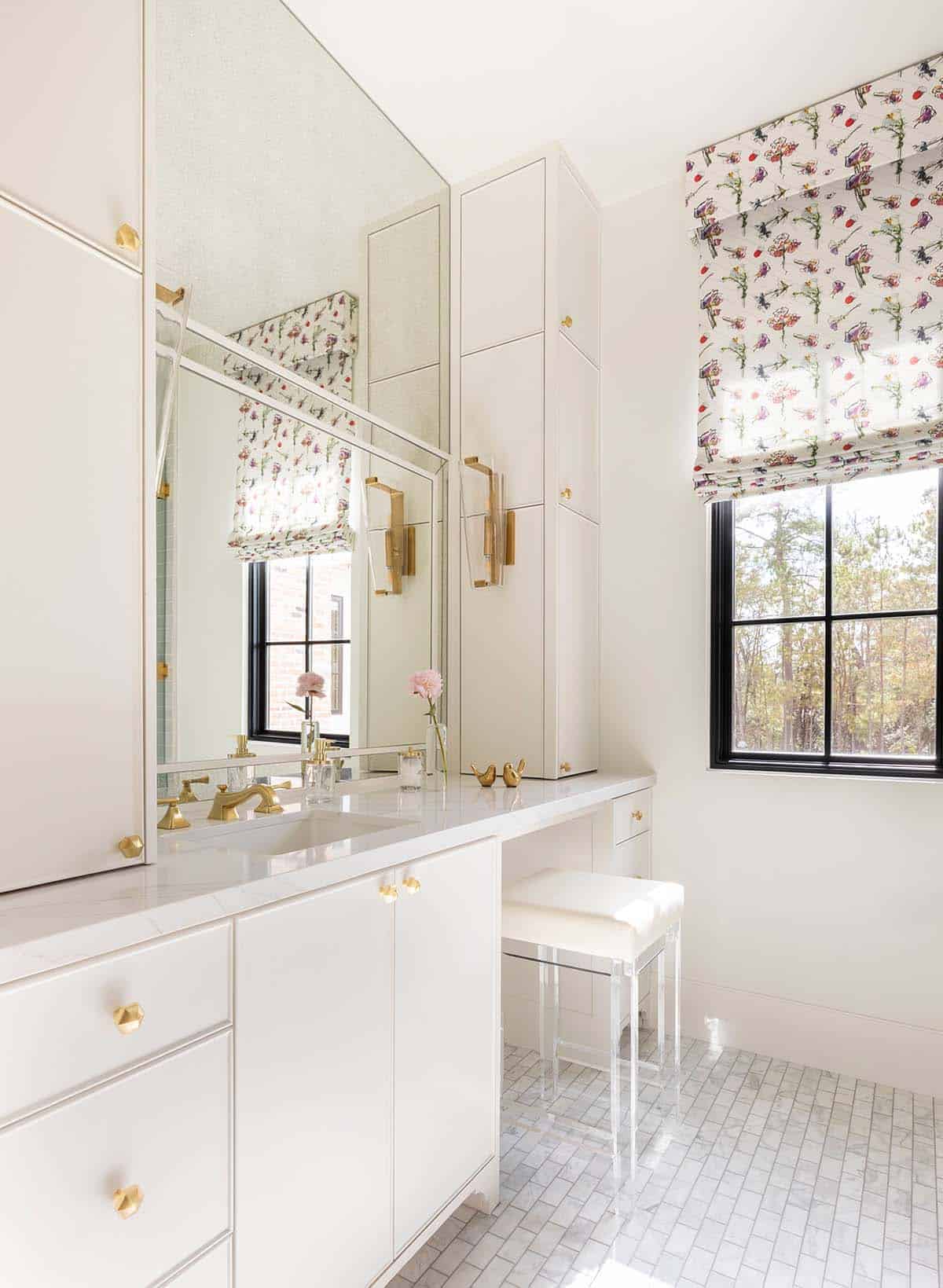White bathroom vanity with floral roman shade and acrylic stool