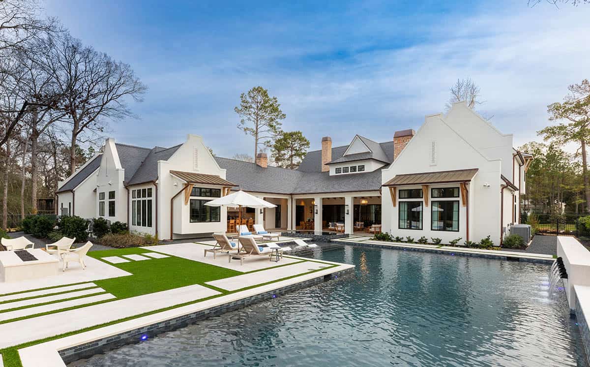 Rear exterior view of Cape Dutch home with pool and geometric patio