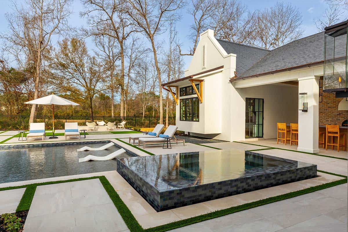 Pool deck with raised tiled spa and Cape Dutch gable exterior