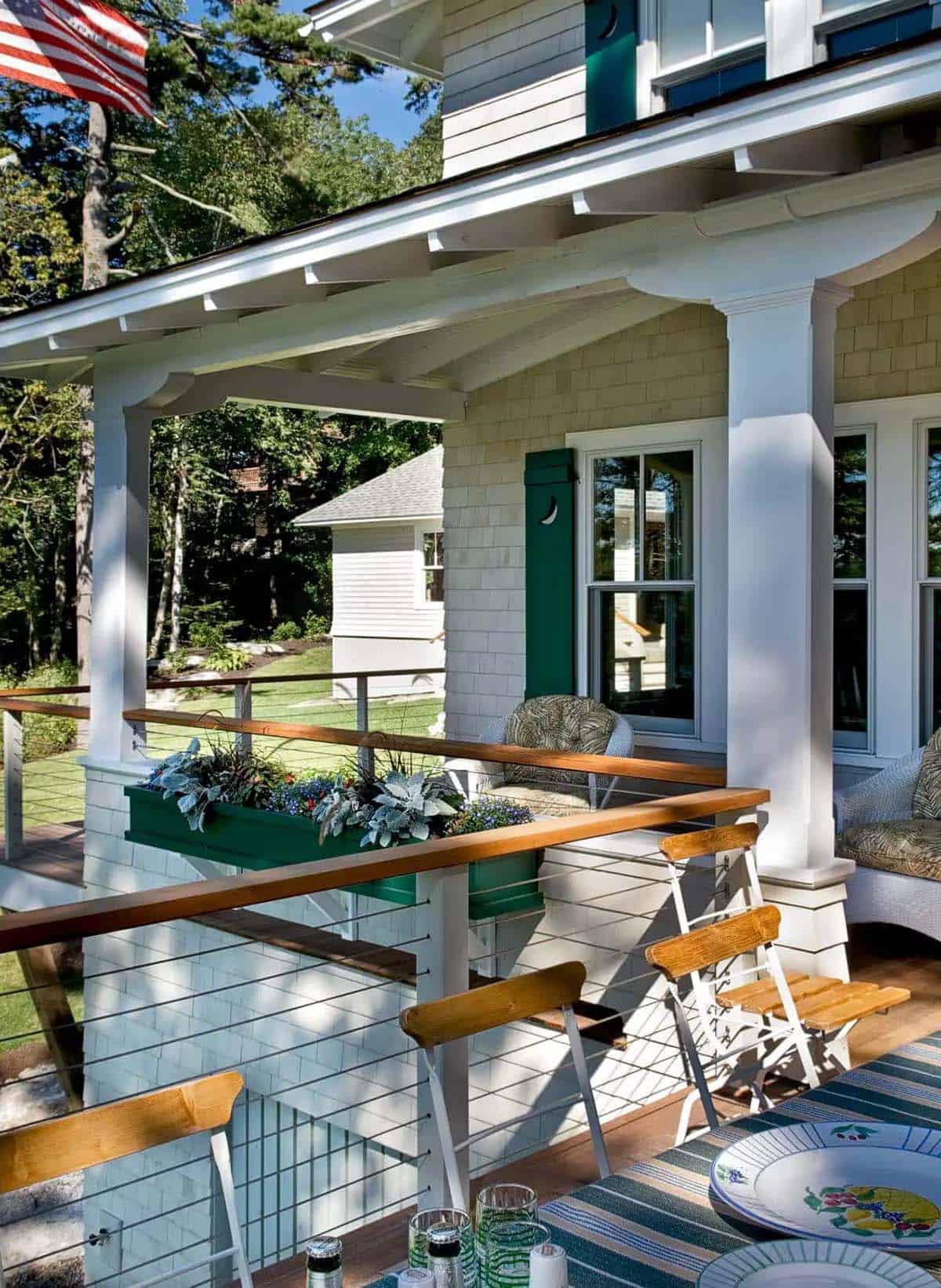 Porch dining nook with flower box and harbor-view railing