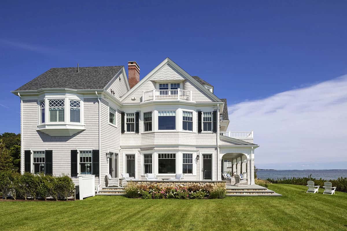 Rear exterior view of shingle-style home facing the ocean