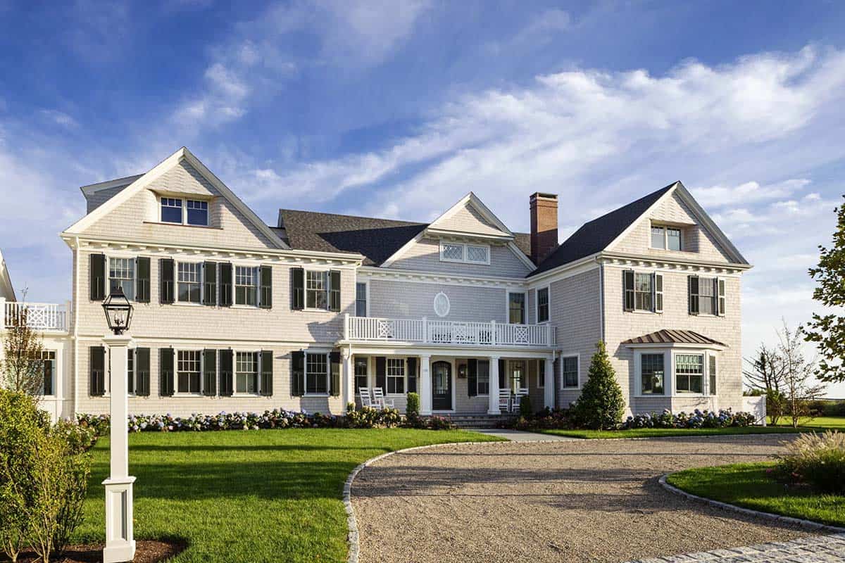 Circular driveway view of gray shingle-style coastal home