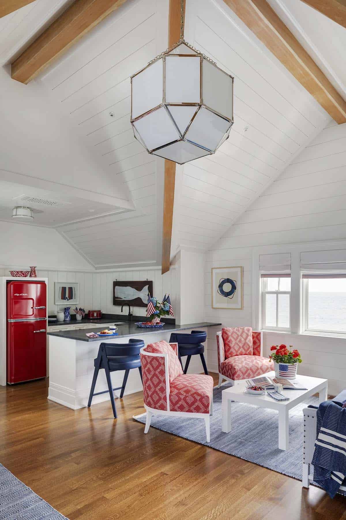 Vaulted family room with red retro fridge and striped chairs