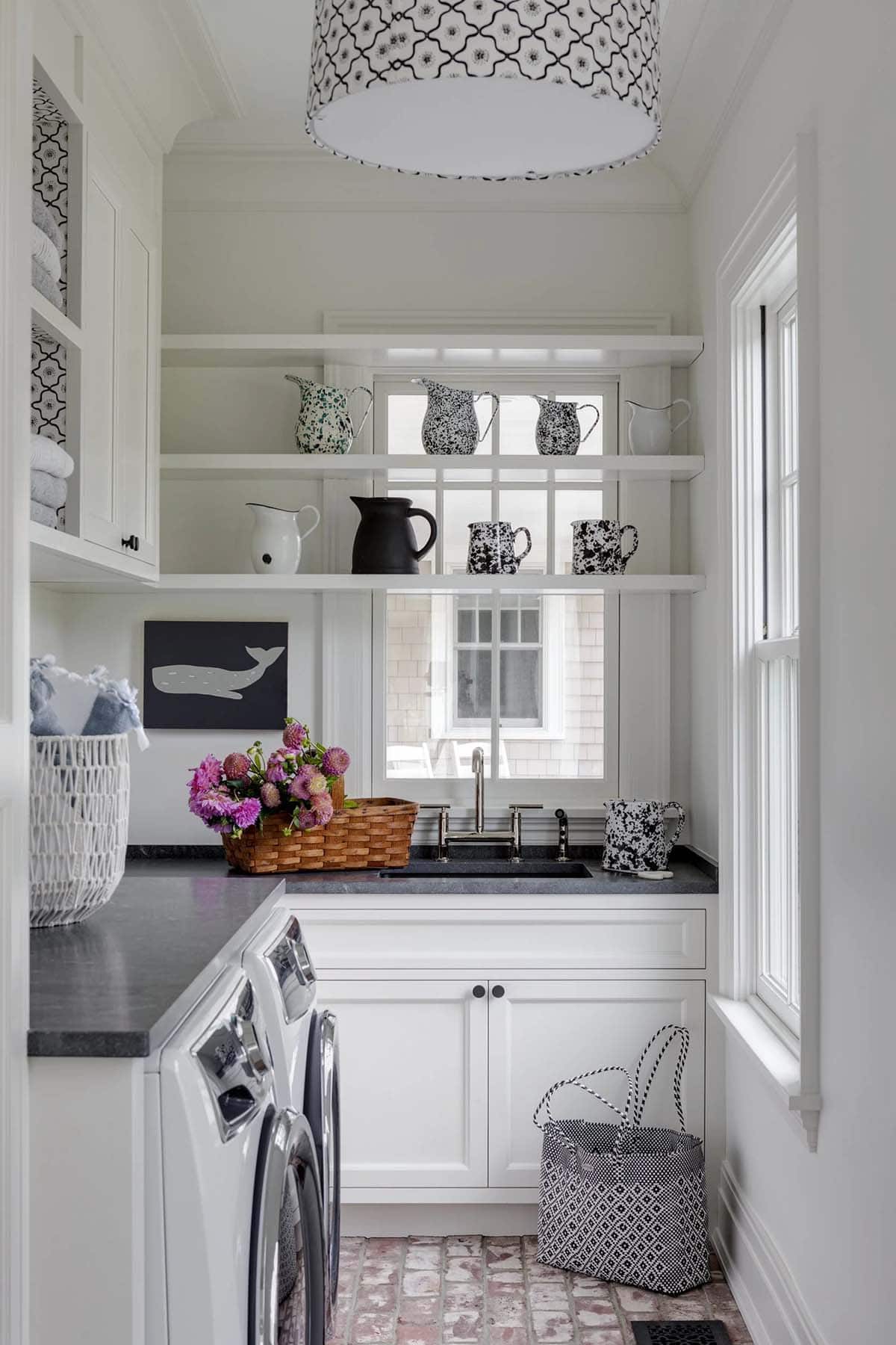White laundry room with mismatched ceramic pitchers on shelving