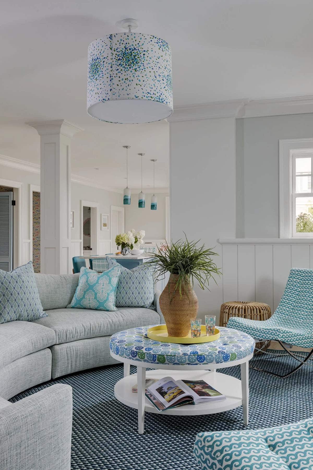 Blue and green living room with wave-print swivel chair