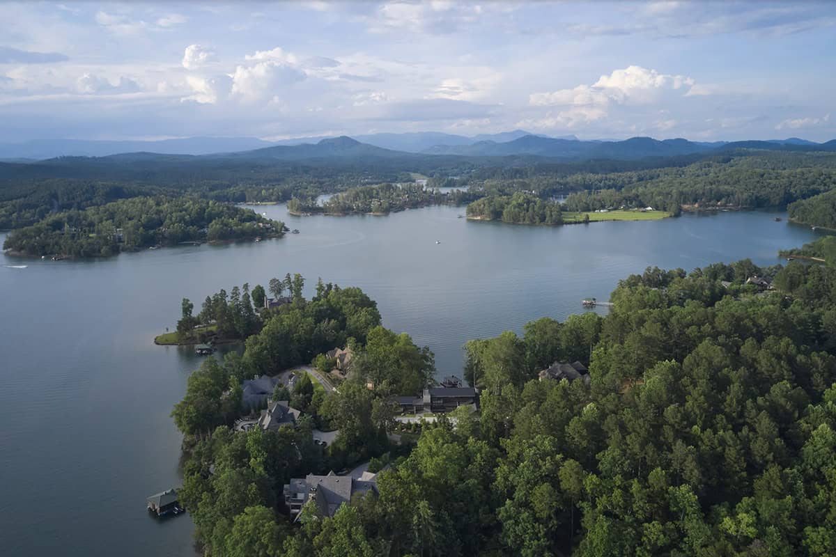 Aerial view of Lake Keowee showing coves, wooded points, and distant mountains