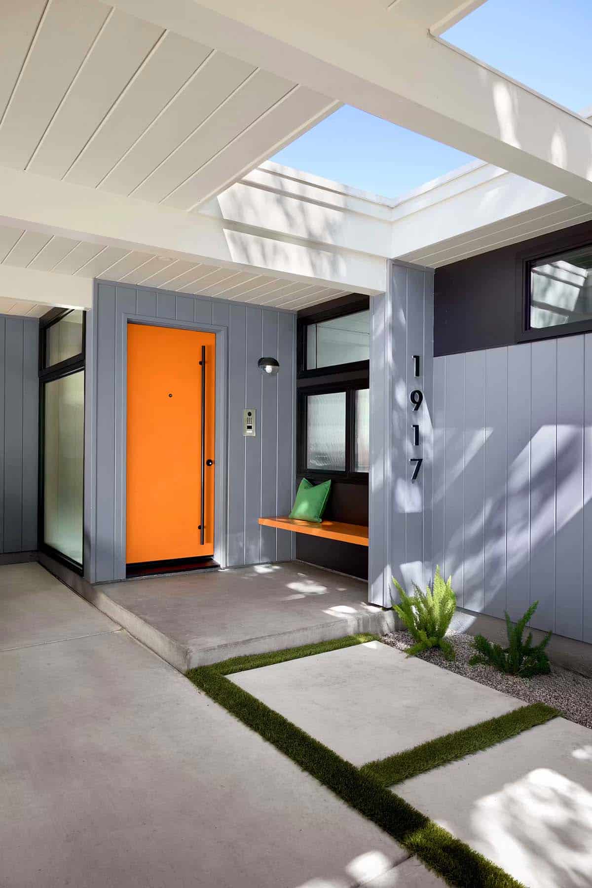Orange front door with skylight and built in bench seating