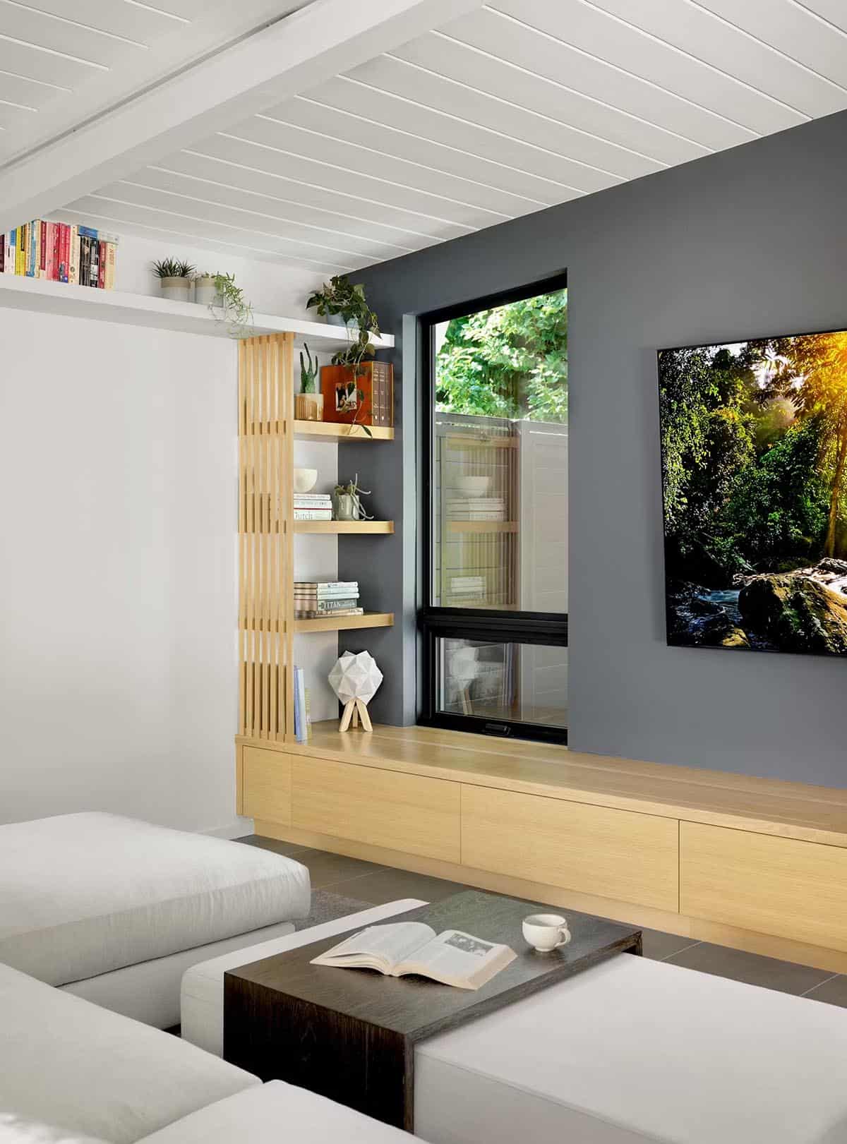 Built in oak media console with dark accent wall
