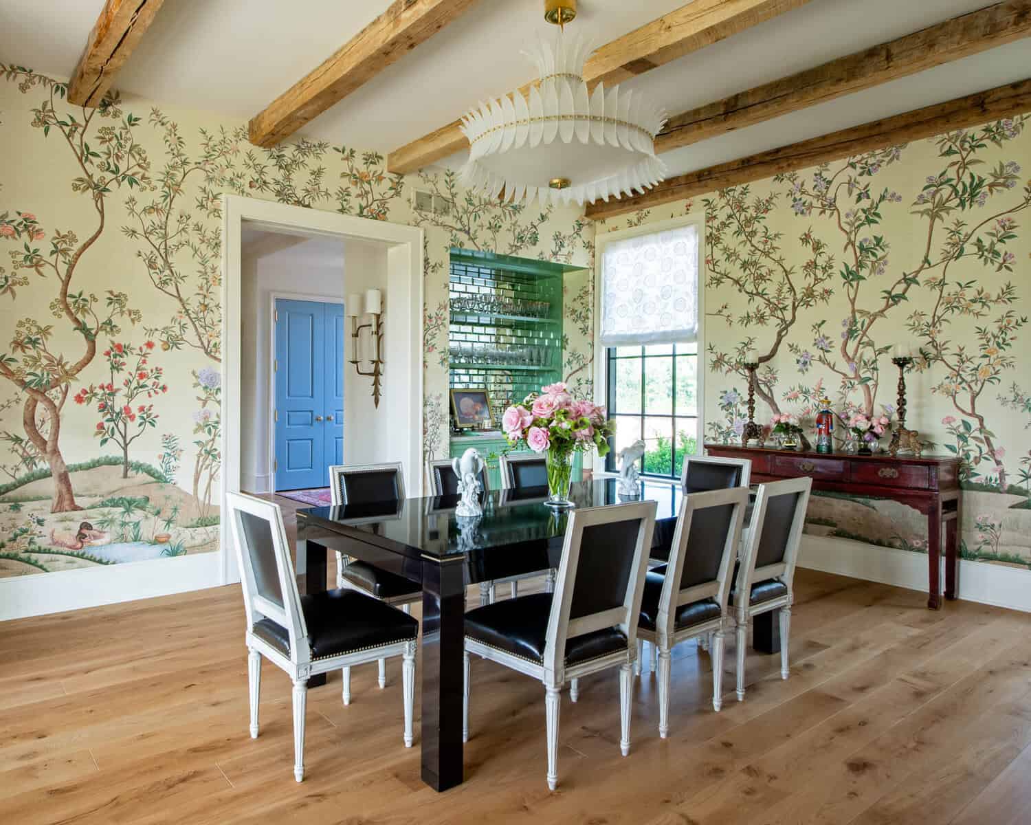 Dining room with chinoiserie wallpaper and black lacquer table