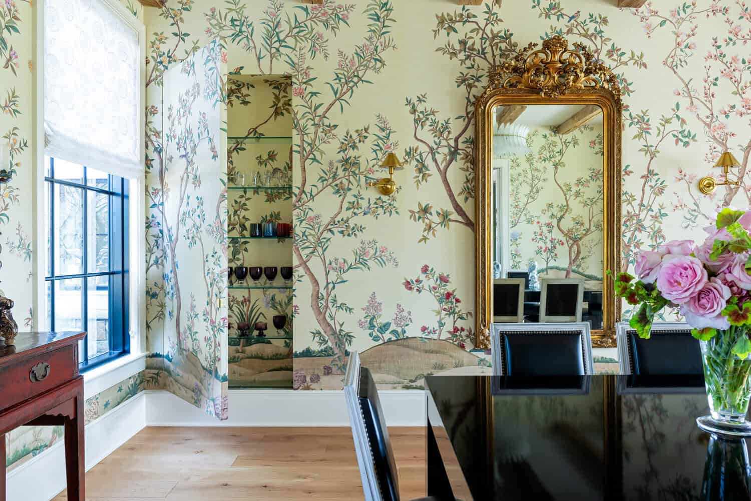 Dining room corner with hidden glass-shelved closet in wallpaper