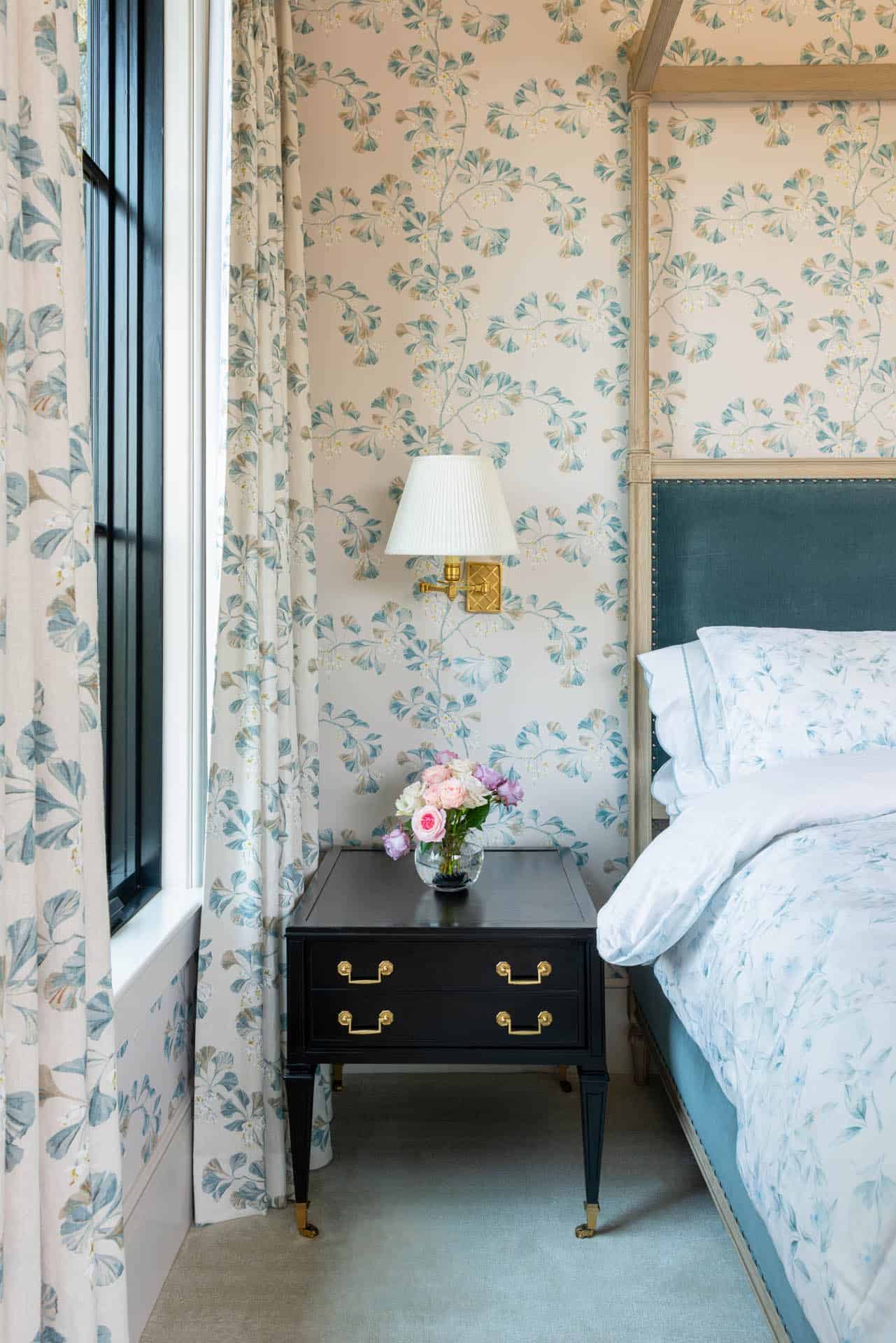 Bedroom nightstand with floral wallpaper and gingko print