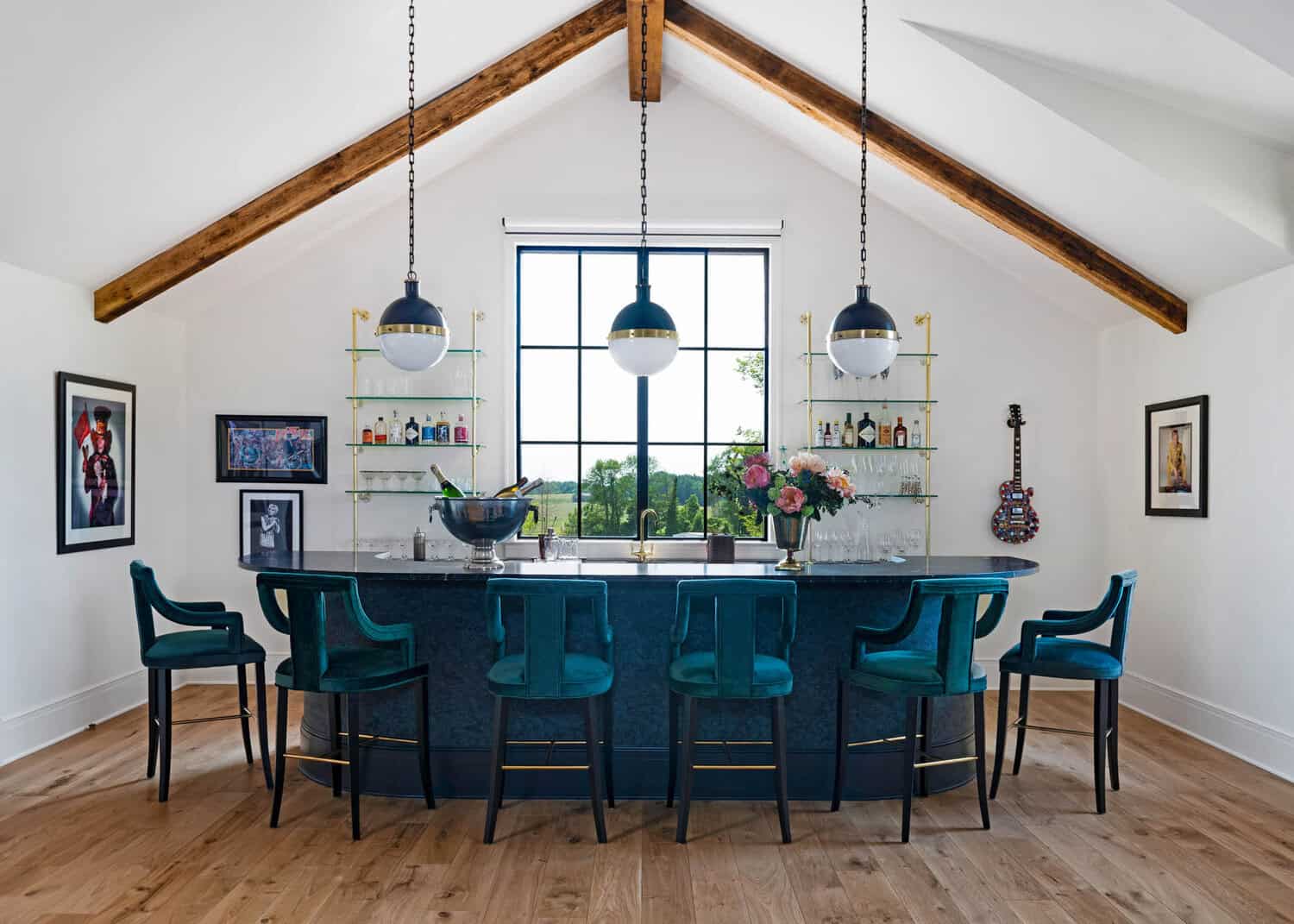 Vaulted game room bar with teal velvet barstools