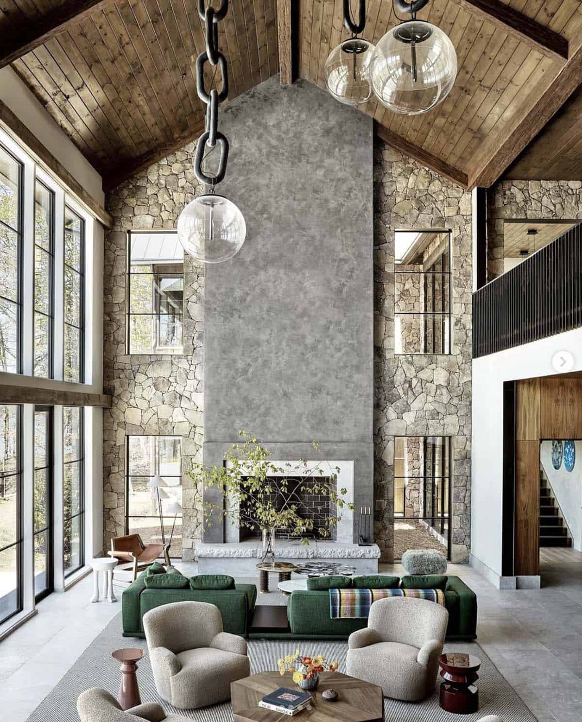 Vaulted great room with glass pendants and green sectional sofa