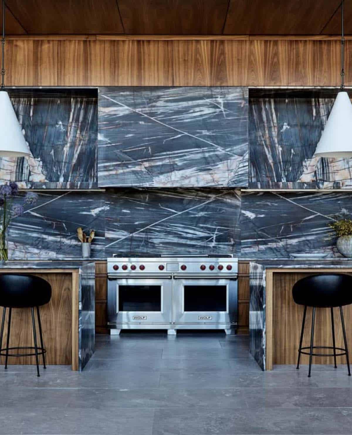 Kitchen with dual range and dramatic slab quartzite backsplash