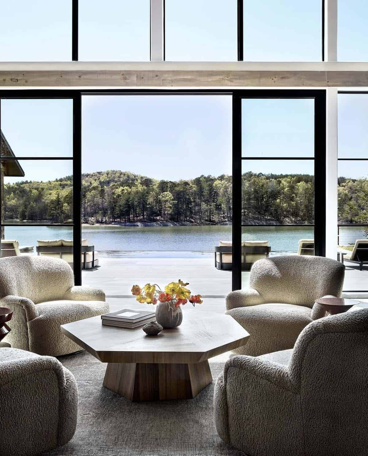 Boucle swivel chairs around hexagonal coffee table facing infinity pool
