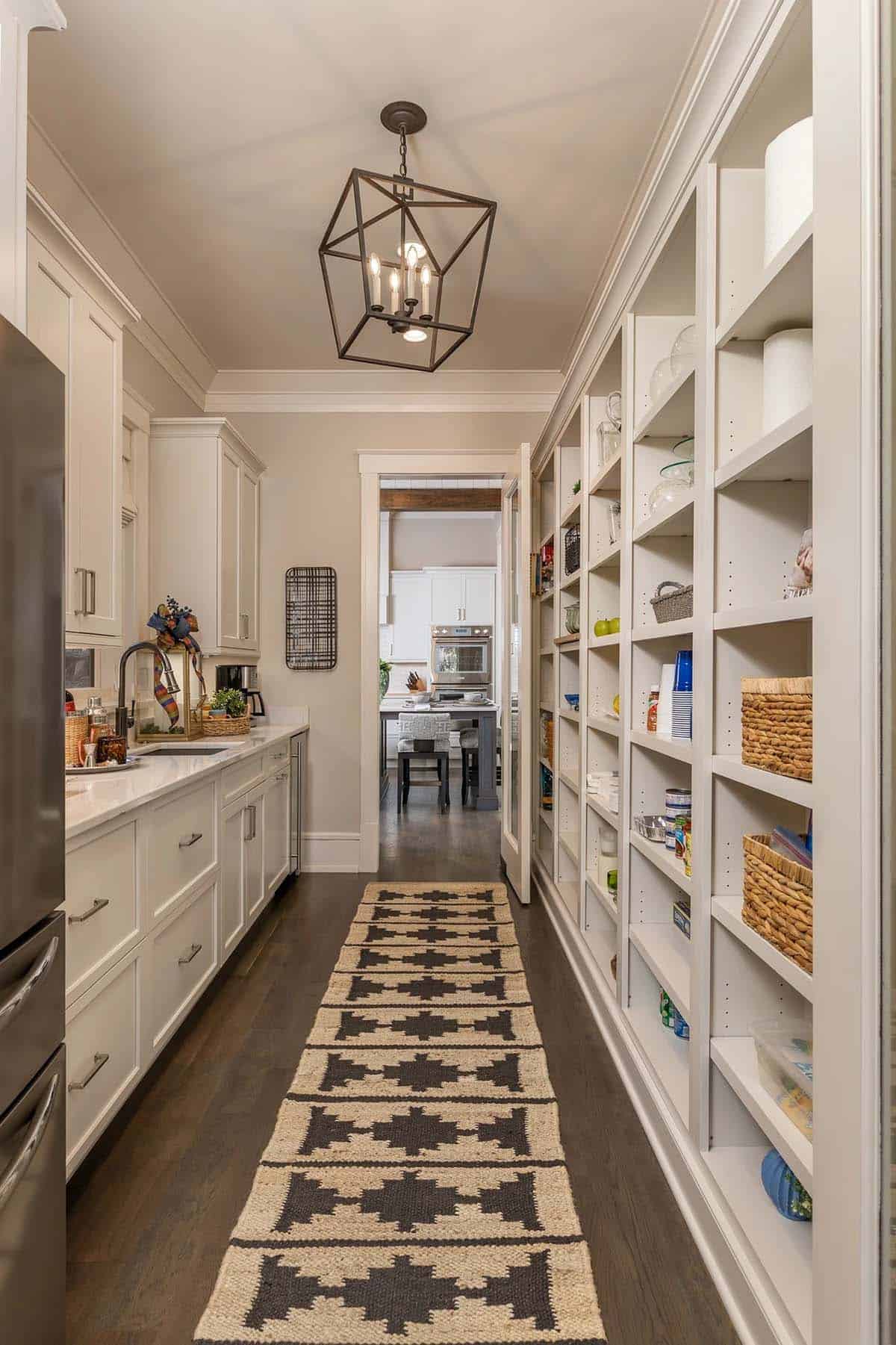 Butler's pantry with open shelving, runner rug, and glass lantern pendant