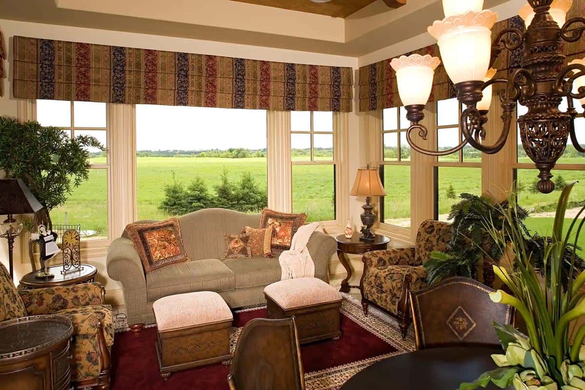 Formal living room with upholstered furniture and large windows