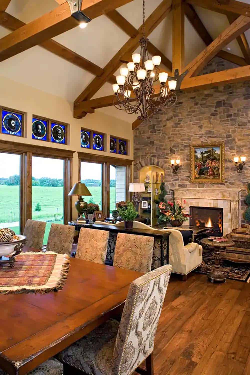 Dining area with stained glass transom windows and stone fireplace wall