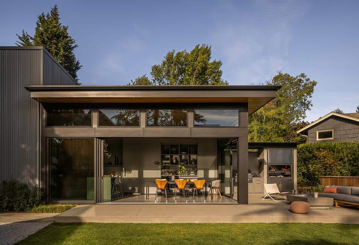 Close-up of the outdoor built-in gas grill and wood-fired grill in use
