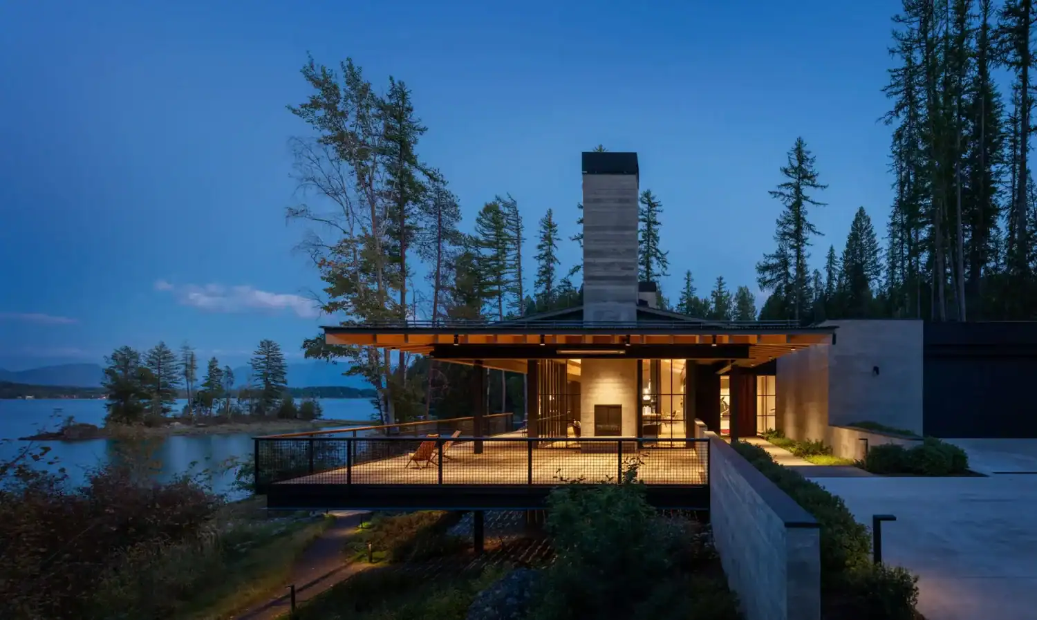 Cantilevered deck overlooking Whitefish Lake at dusk