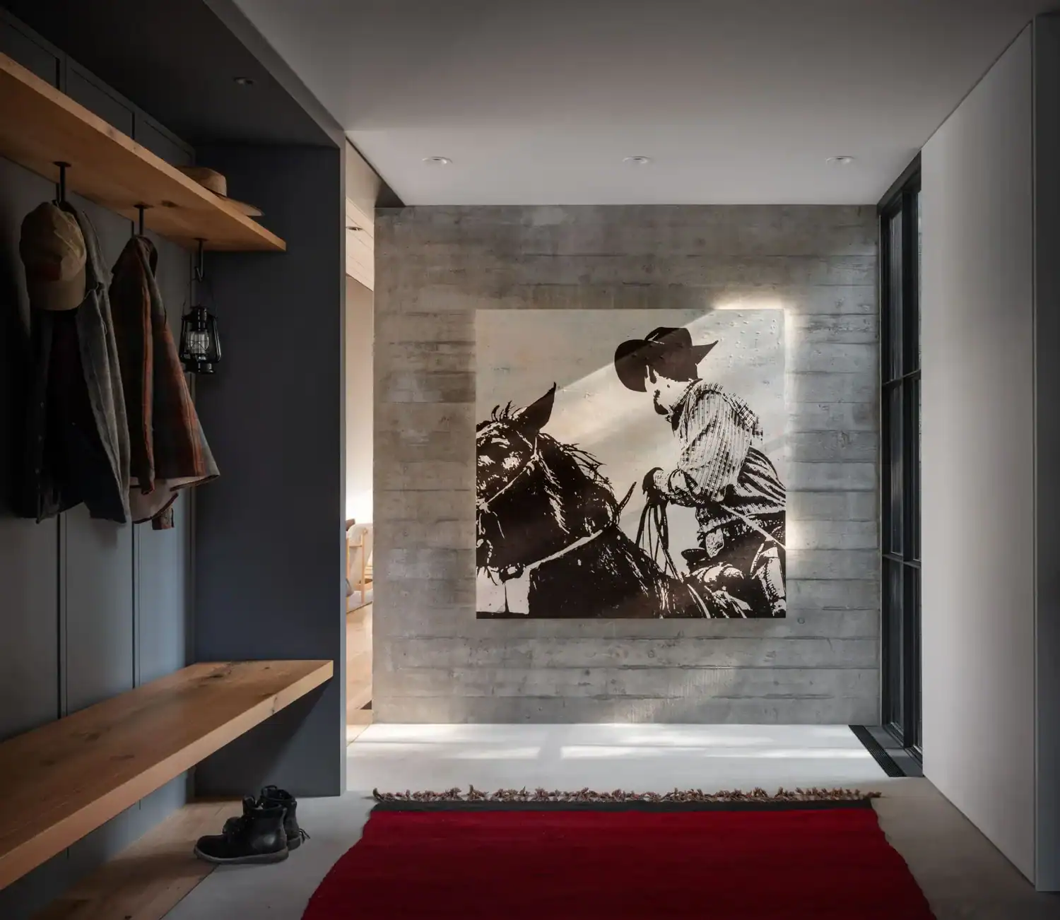 Concrete entry hall with western-themed artwork