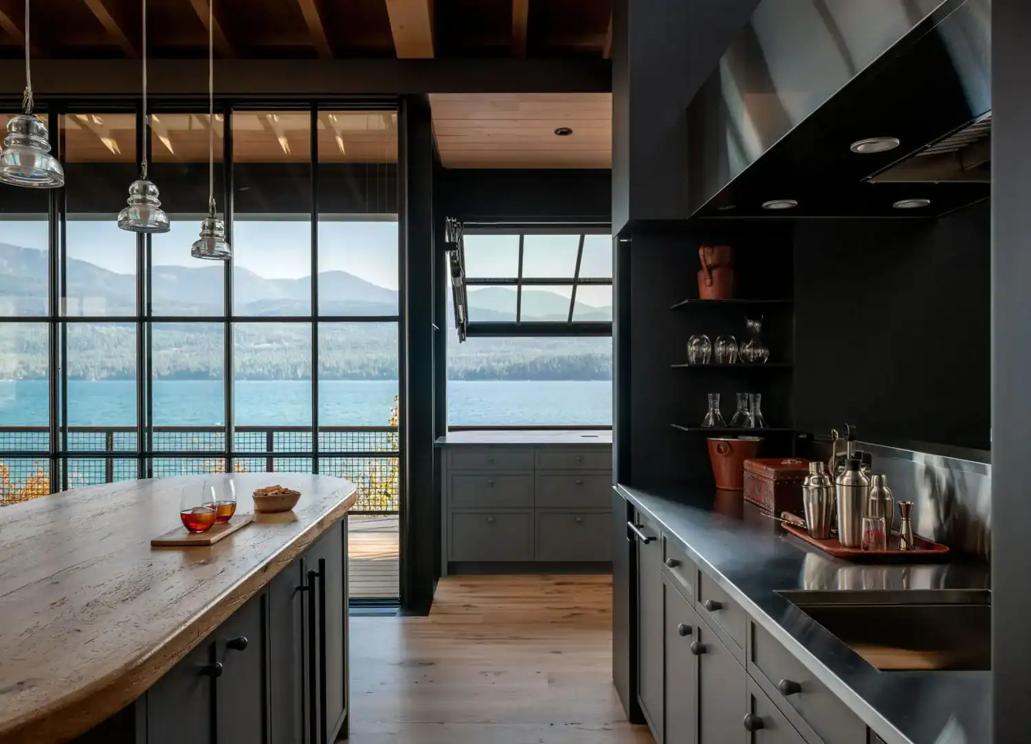 Bar nook with glass pendants overlooking the lake
