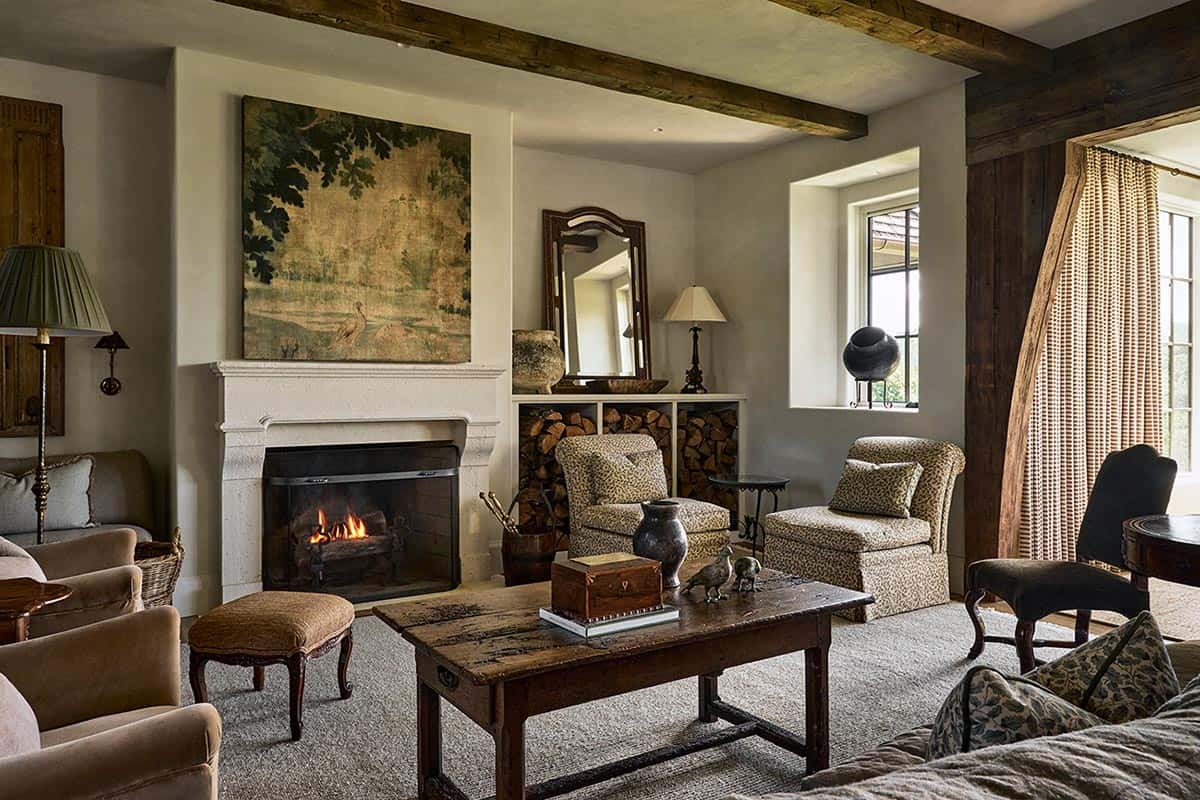 Living room fireplace with botanical artwork, leopard print chairs and beams