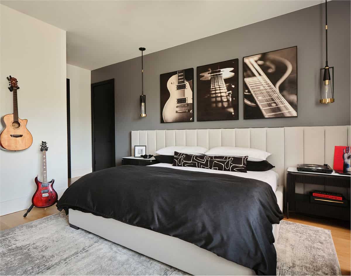 Teen bedroom with electric guitars on wall and framed guitar close-up photography above bed
