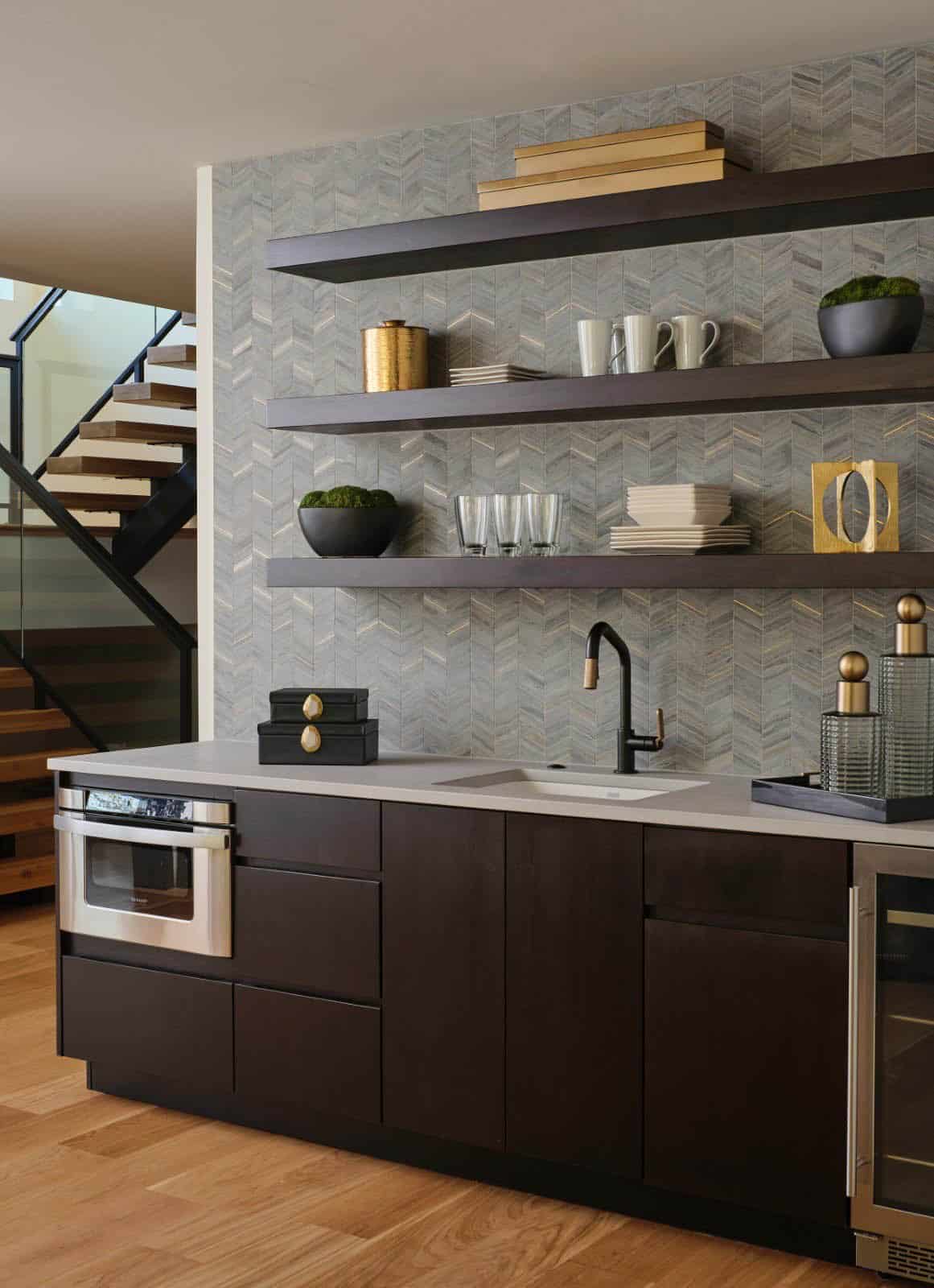 Wet bar with chevron tile backsplash, open shelving, and built-in microwave