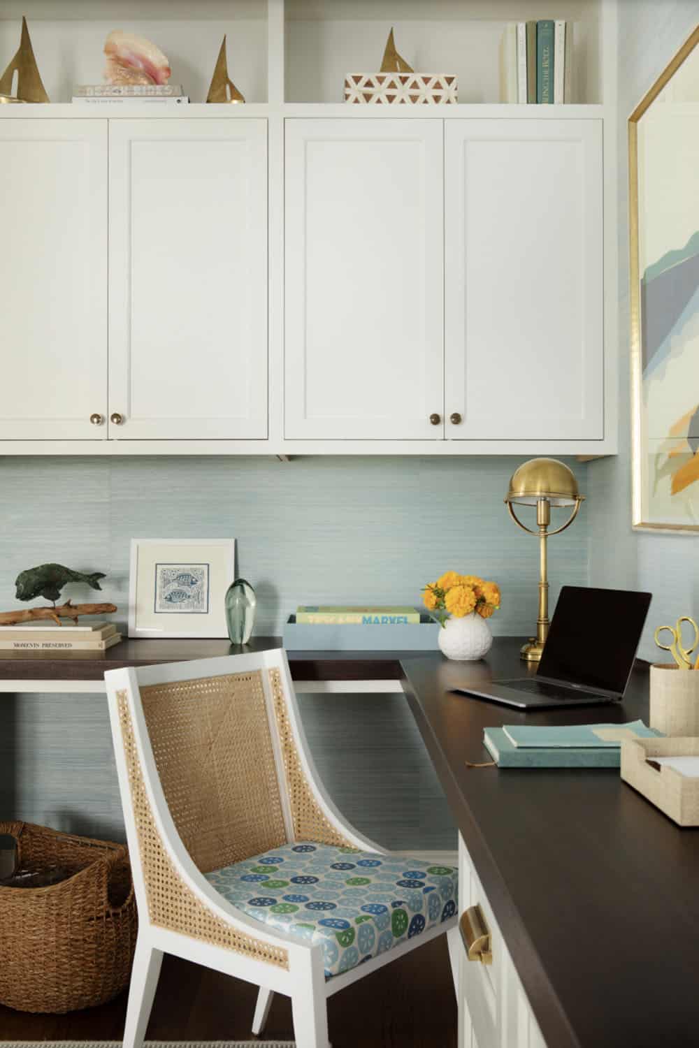 Home office desk with cane chair and coastal accessories