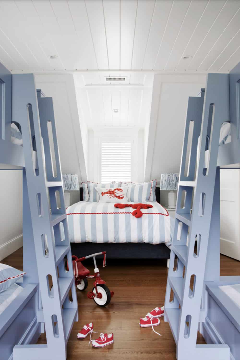 Bunk room with blue ladders and lobster themed bedding