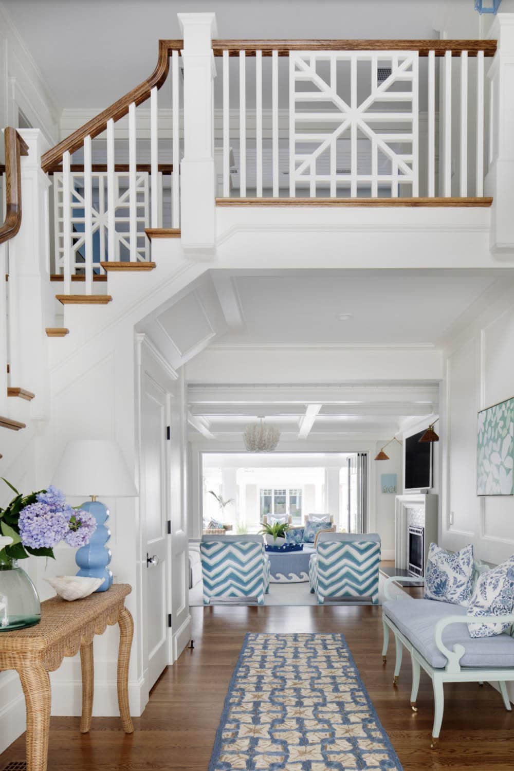 Foyer view toward living room with chevron patterned chairs