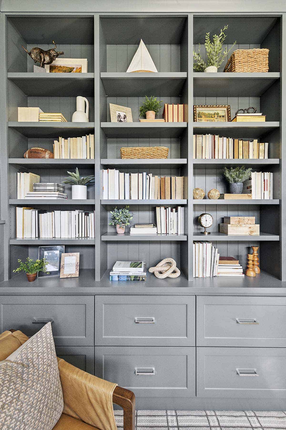 Gray built-in bookshelves styled with books and decor